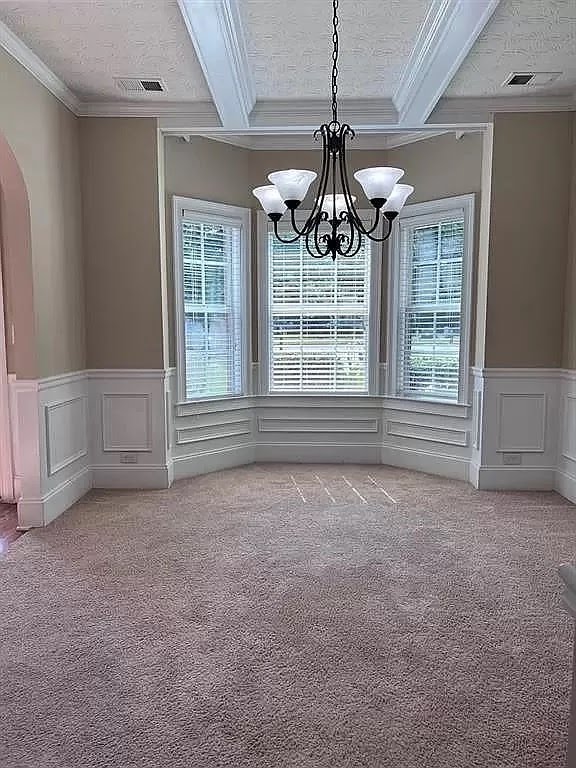 Dining area with bay windows and white trim