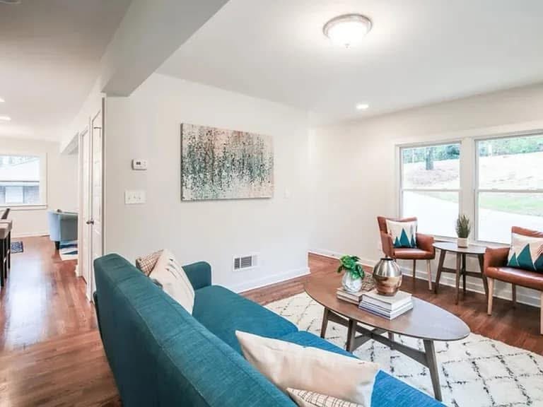 Bright living room with teal sofa