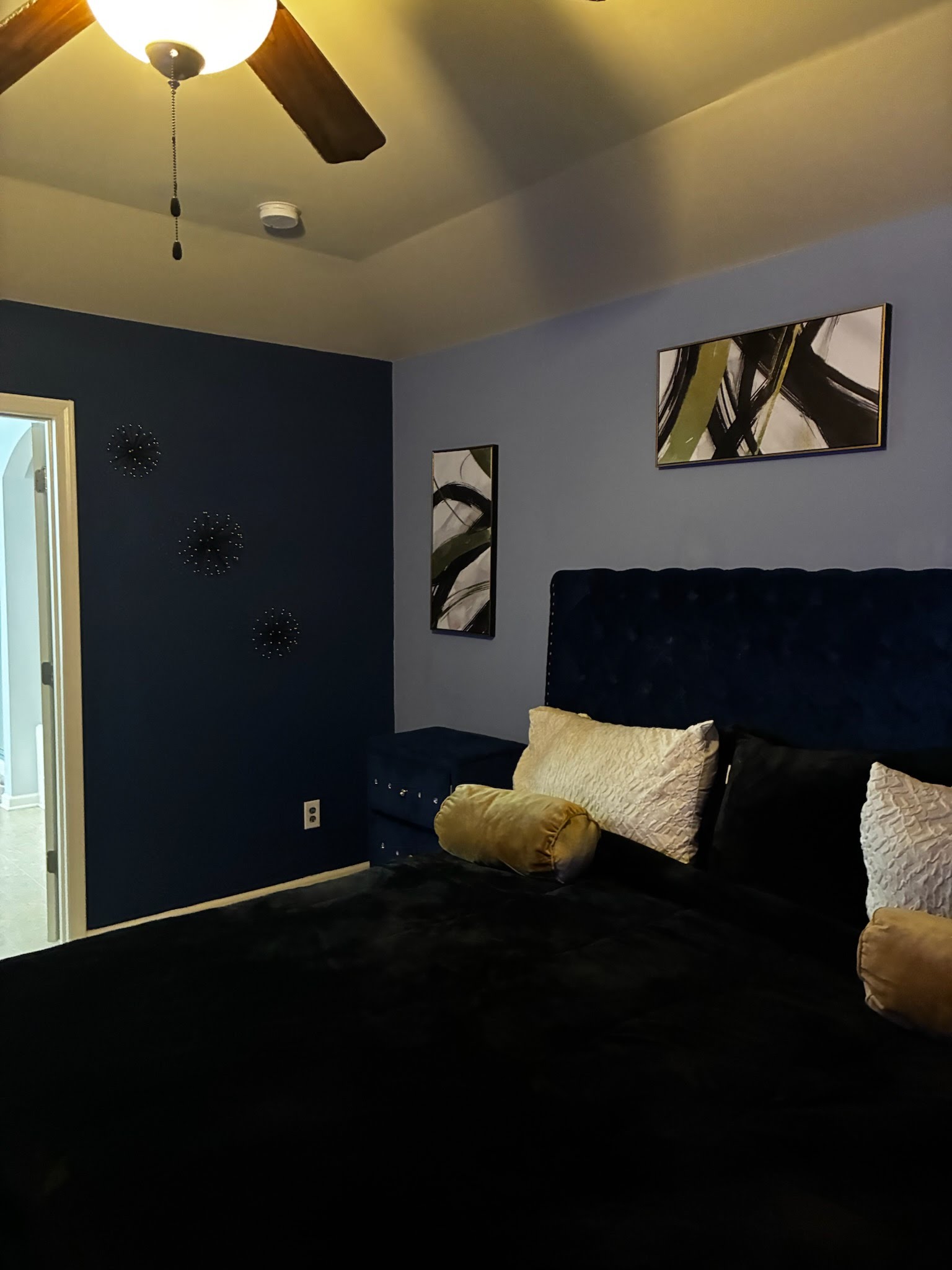 Bedroom with navy accent wall