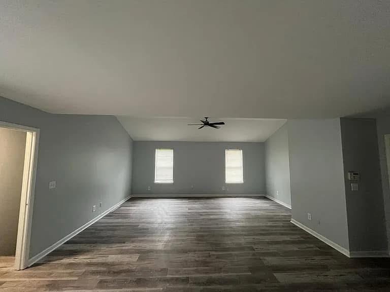 Open gray room with wood-look flooring