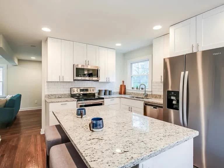 White kitchen with stone countertops