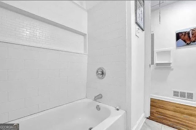 White tub and shower tile